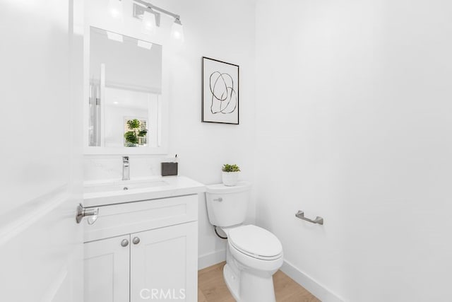 61 Jade Flower, Irvine, CA 92620 - half bath with toilet, vanity, and wood finished floors