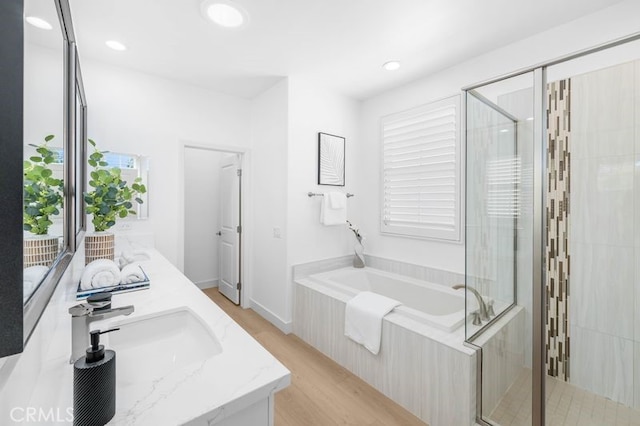 61 Jade Flower, Irvine, CA 92620 - full bath with a stall shower, a garden tub, wood finished floors, double vanity, and recessed lighting