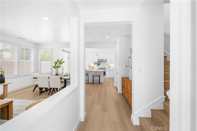 61 Jade Flower, Irvine, CA 92620 - corridor with light wood-style floors, recessed lighting, stairway, and baseboards