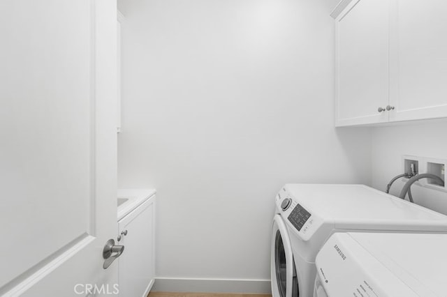 61 Jade Flower, Irvine, CA 92620 - laundry area featuring cabinet space, washer and clothes dryer, and baseboards