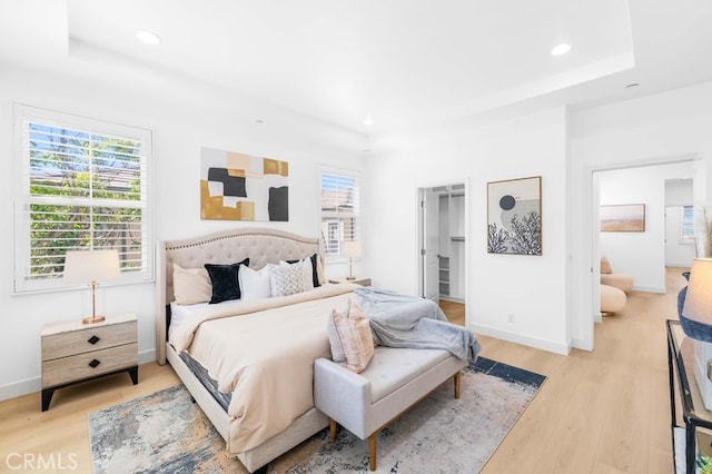 61 Jade Flower, Irvine, CA 92620 - bedroom featuring light wood-style flooring, multiple windows, recessed lighting, and baseboards