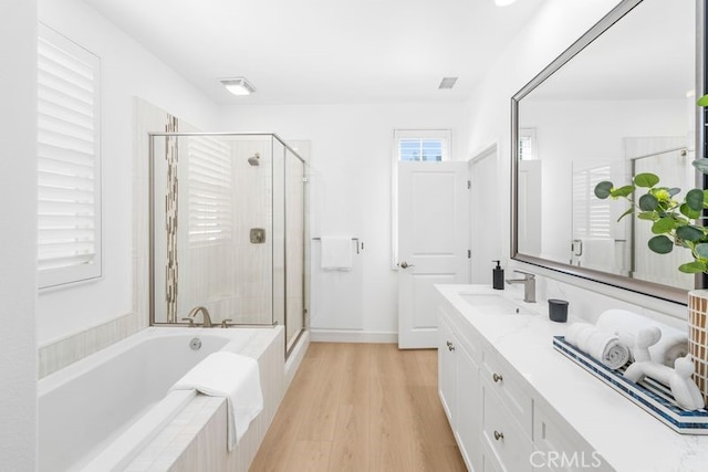 61 Jade Flower, Irvine, CA 92620 - bathroom featuring a bath, vanity, a shower stall, and wood finished floors