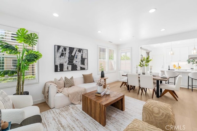 61 Jade Flower, Irvine, CA 92620 - living area with light wood-type flooring, recessed lighting, and baseboards