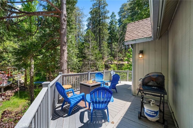 635 Grass Valley Rd, Lake Arrowhead, CA 92352 - wooden deck featuring a fire pit and a grill