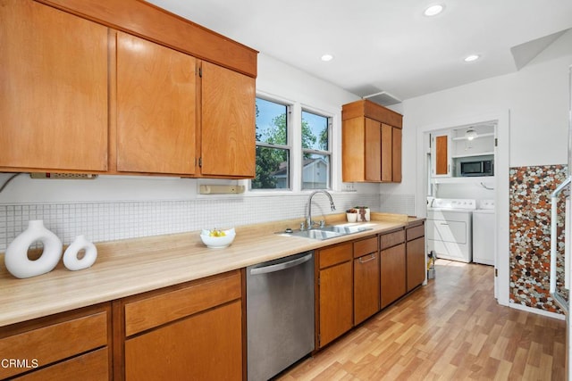 1675 N El Molino Ave, Pasadena, CA 91104 - kitchen with stainless steel appliances, a sink, light countertops, washer and dryer, and light wood-type flooring