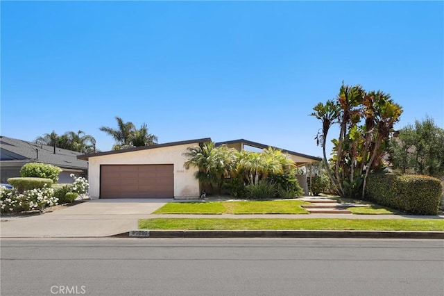 33292 Bremerton St, Dana Point, CA 92629 - view of front facade featuring driveway, an attached garage, and stucco siding