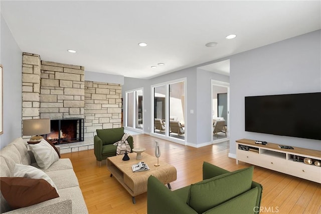 33292 Bremerton St, Dana Point, CA 92629 - living room with a stone fireplace, wood finished floors, recessed lighting, and baseboards