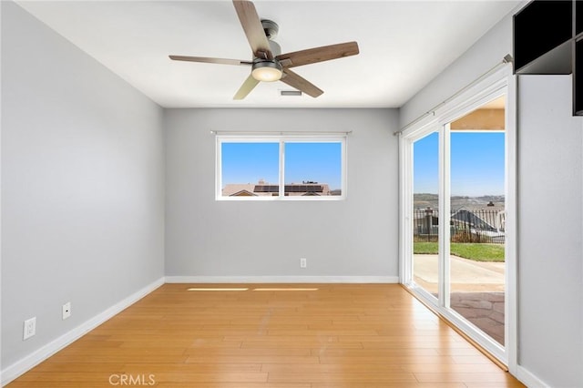 33292 Bremerton St, Dana Point, CA 92629 - unfurnished room featuring a ceiling fan, healthy amount of natural light, baseboards, and light wood-style flooring
