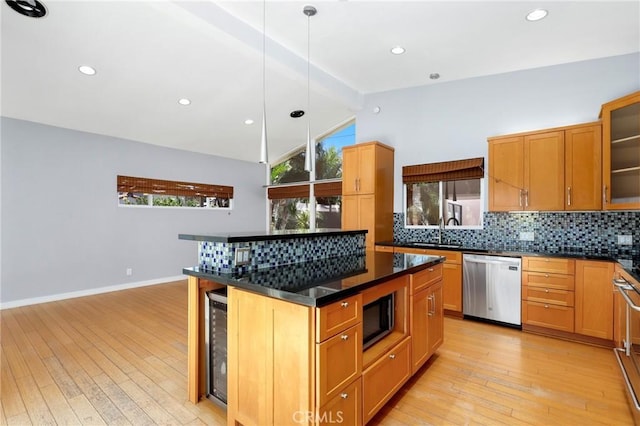 33292 Bremerton St, Dana Point, CA 92629 - kitchen featuring stainless steel appliances, tasteful backsplash, dark countertops, light wood-style floors, and recessed lighting