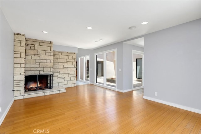 33292 Bremerton St, Dana Point, CA 92629 - unfurnished living room with a stone fireplace, baseboards, wood finished floors, and recessed lighting