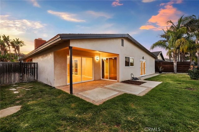 33292 Bremerton St, Dana Point, CA 92629 - back of property featuring stucco siding, a chimney, and a patio