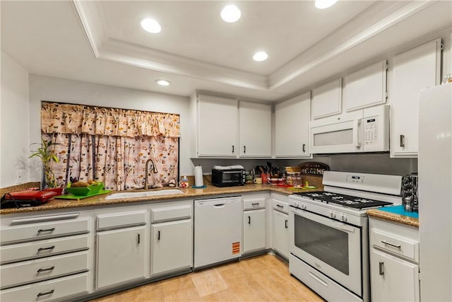 149 S Hollenbeck Ave, Covina, CA 91723 - kitchen featuring white appliances, a sink, a raised ceiling, ornamental molding, and white cabinetry