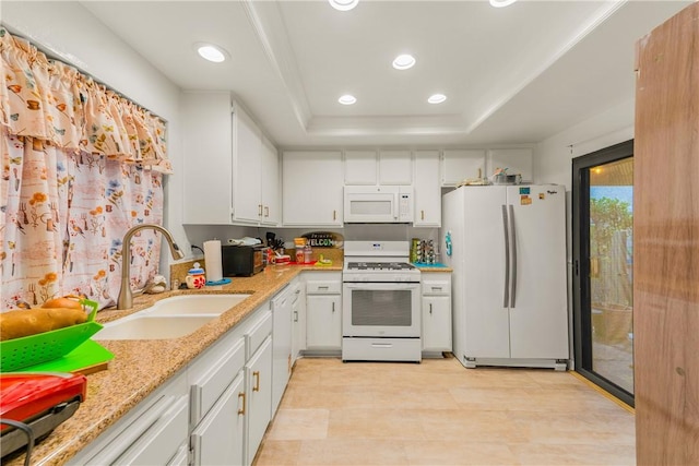 149 S Hollenbeck Ave, Covina, CA 91723 - kitchen with white appliances, a sink, a raised ceiling, white cabinets, and recessed lighting