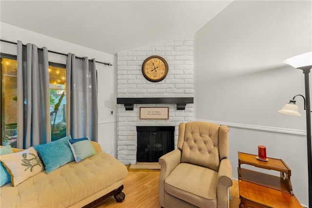 149 S Hollenbeck Ave, Covina, CA 91723 - living area featuring vaulted ceiling, wood finished floors, and a fireplace