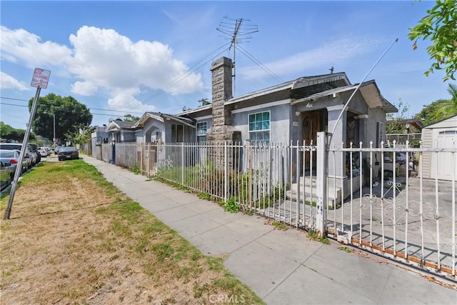 1500 W 59th Pl, Los Angeles, CA 90047 - view of front of house featuring a fenced front yard and stucco siding