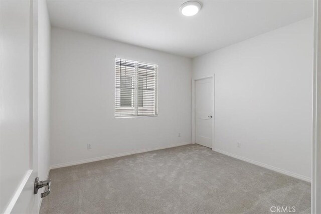 4852 S Jordan Ave, Ontario, CA 91762 - unfurnished room featuring carpet floors and baseboards