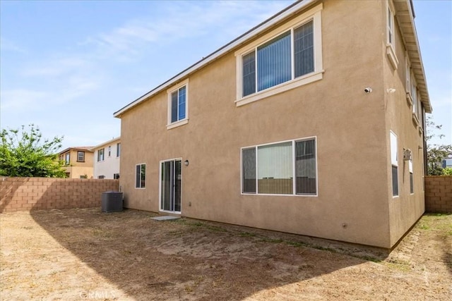 4852 S Jordan Ave, Ontario, CA 91762 - back of property with central air condition unit, a fenced backyard, and stucco siding