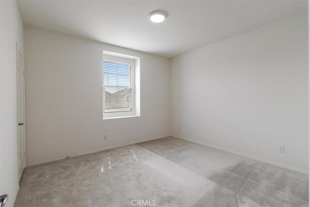 4852 S Jordan Ave, Ontario, CA 91762 - carpeted spare room with baseboards