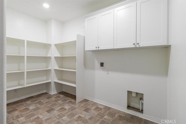 4852 S Jordan Ave, Ontario, CA 91762 - washroom with hookup for a washing machine, baseboards, stone finish flooring, cabinet space, and recessed lighting