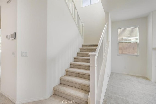 4852 S Jordan Ave, Ontario, CA 91762 - staircase featuring carpet and baseboards