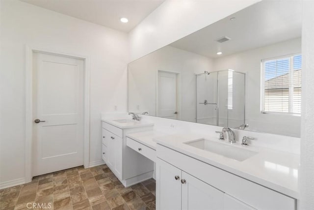 4852 S Jordan Ave, Ontario, CA 91762 - full bath with double vanity, a shower stall, stone finish flooring, recessed lighting, and baseboards