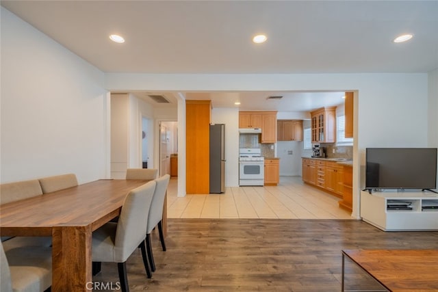 10404 Jardine Ave, Sunland, CA 91040 - dining area with light wood-style flooring and recessed lighting