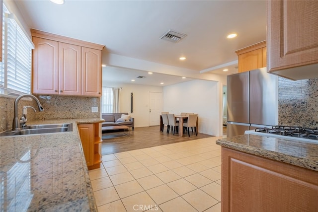 10404 Jardine Ave, Sunland, CA 91040 - kitchen with a sink, light brown cabinets, tasteful backsplash, healthy amount of natural light, and recessed lighting