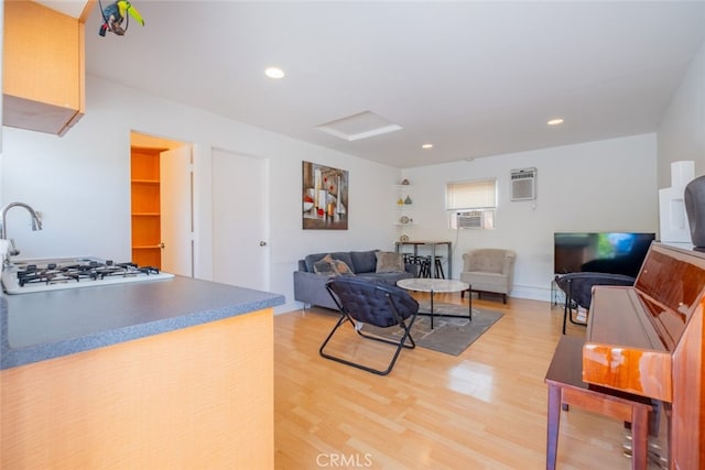 10404 Jardine Ave, Sunland, CA 91040 - living area featuring attic access, light wood-style floors, recessed lighting, cooling unit, and a wall unit AC