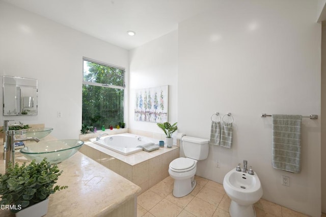 1196 Montecito Dr, Los Angeles, CA 90031 - bathroom with a bidet, a bath, tile patterned flooring, toilet, and double vanity