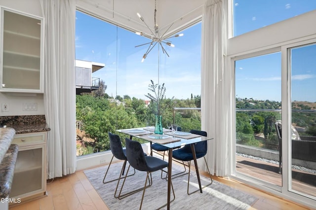 1196 Montecito Dr, Los Angeles, CA 90031 - dining space featuring a chandelier and light wood-type flooring