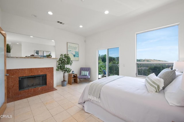 1196 Montecito Dr, Los Angeles, CA 90031 - bedroom featuring a fireplace with flush hearth, light tile patterned floors, recessed lighting, and access to exterior