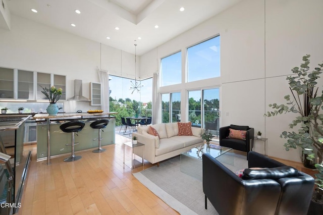 1196 Montecito Dr, Los Angeles, CA 90031 - living area featuring a high ceiling, recessed lighting, and light wood-style floors