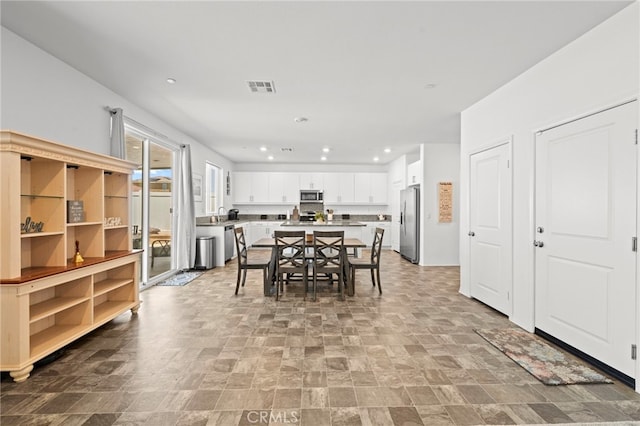 27241 Toro Vista St, Menifee, CA 92585 - dining room with stone finish floors and recessed lighting
