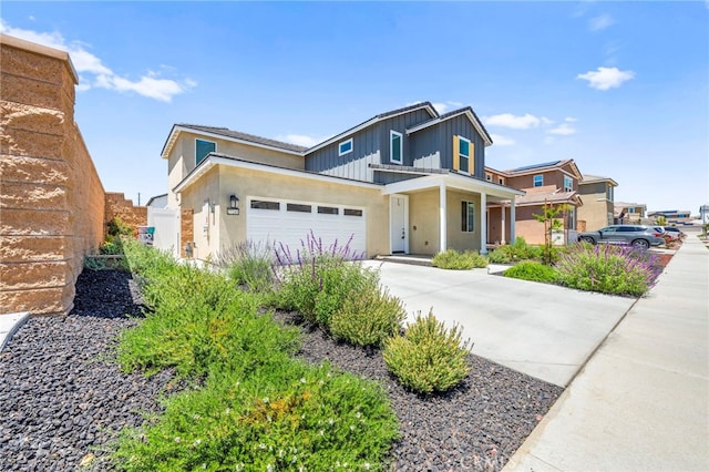 27241 Toro Vista St, Menifee, CA 92585 - view of front of home with driveway, an attached garage, board and batten siding, a porch, and stucco siding
