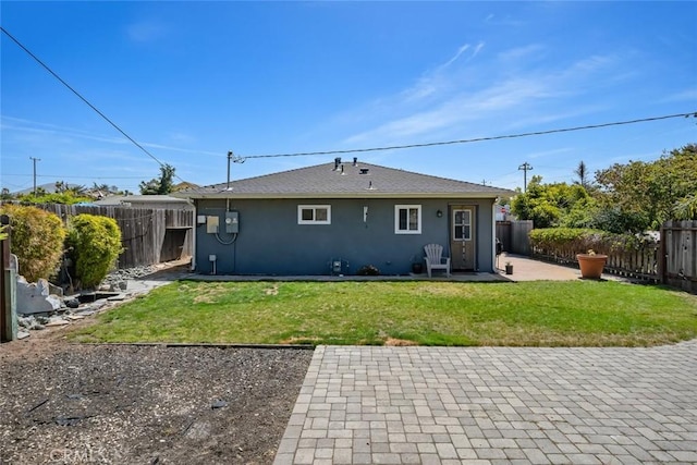 870 El Moro Ave, Los Osos, CA 93402 - rear view of property with stucco siding and a patio area