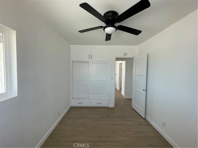 6663 Sage Ave Unit 29, Palms, CA 92277 - unfurnished bedroom with wood finished floors, baseboards, and ceiling fan