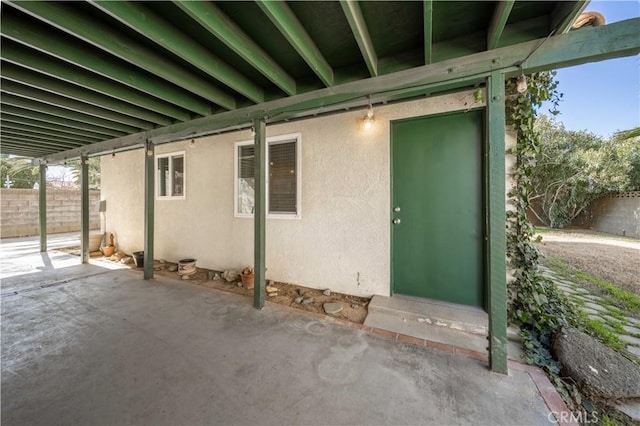 43007 Pearlwood Dr, Lancaster, CA 93536 - doorway to property featuring stucco siding and a patio area