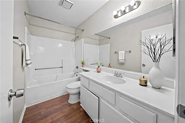 43007 Pearlwood Dr, Lancaster, CA 93536 - full bathroom with shower / bath combination, vanity, toilet, wood finished floors, and baseboards