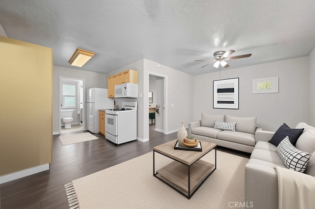 43007 Pearlwood Dr, Lancaster, CA 93536 - living area featuring ceiling fan, baseboards, and dark wood-style floors