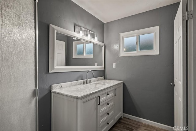 417 Jefferson St, Willows, CA 95988 - bathroom with vanity, wood finished floors, and baseboards