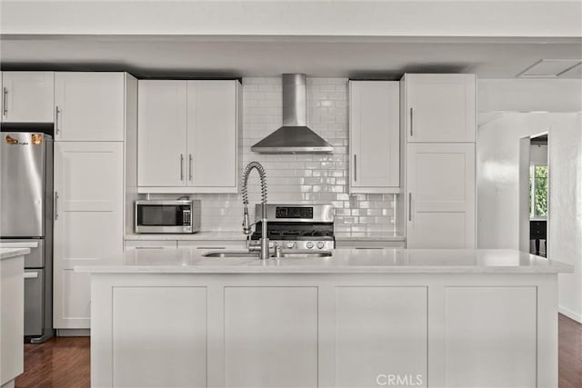 417 Jefferson St, Willows, CA 95988 - kitchen with wall chimney range hood, stainless steel appliances, and white cabinetry