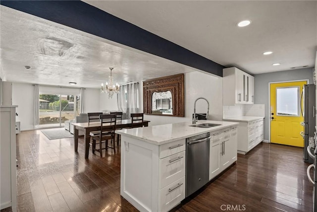 417 Jefferson St, Willows, CA 95988 - kitchen featuring appliances with stainless steel finishes, a sink, white cabinets, dark wood-style flooring, and light stone counters
