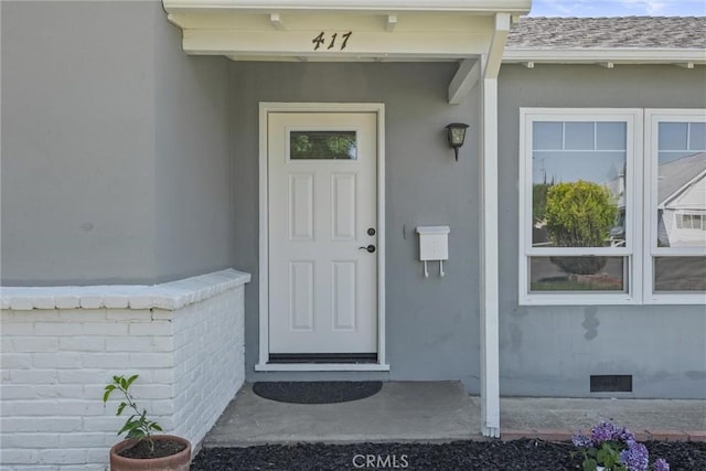 417 Jefferson St, Willows, CA 95988 - property entrance with crawl space, stucco siding, and roof with shingles