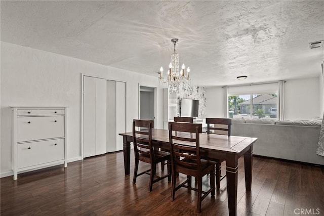 417 Jefferson St, Willows, CA 95988 - dining room featuring a chandelier, dark wood-style flooring, and a textured ceiling