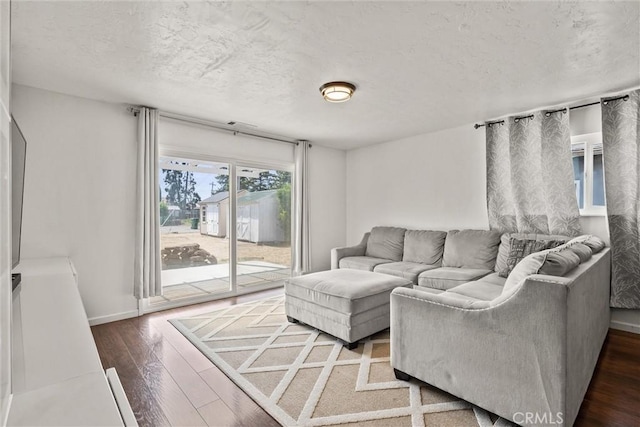 417 Jefferson St, Willows, CA 95988 - living area with a textured ceiling, hardwood / wood-style flooring, and baseboards