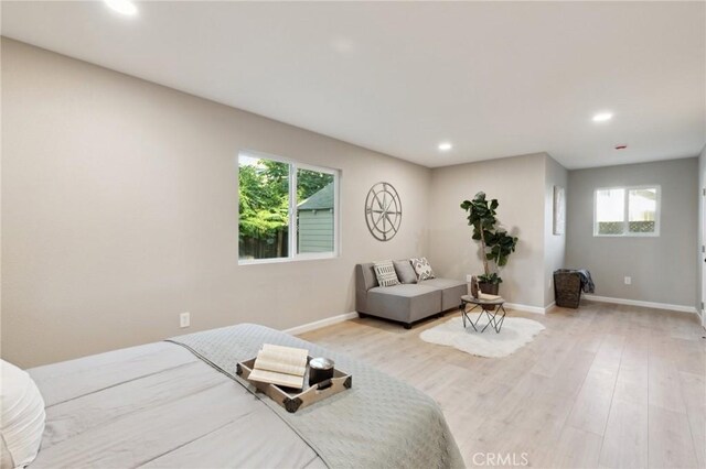 325 N 3rd Ave, Oakdale, CA 95361 - bedroom featuring recessed lighting, multiple windows, wood finished floors, and baseboards