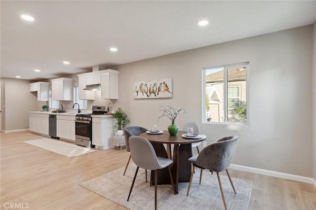 325 N 3rd Ave, Oakdale, CA 95361 - dining area featuring light wood-style floors, baseboards, and recessed lighting