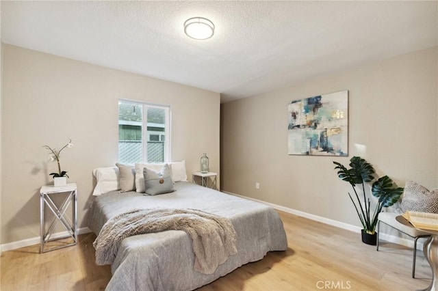 325 N 3rd Ave, Oakdale, CA 95361 - bedroom featuring light wood-type flooring and baseboards