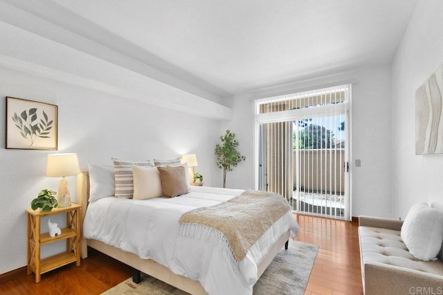 7254 Shoreline Dr Unit 131, San Diego, CA 92122 - bedroom with access to outside, wood finished floors, and baseboards