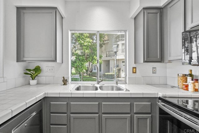 7254 Shoreline Dr Unit 131, San Diego, CA 92122 - kitchen featuring a sink, gray cabinets, and black microwave